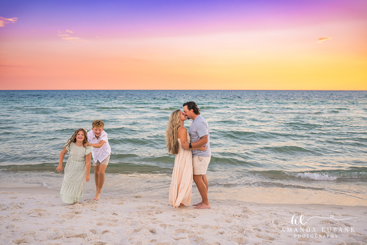 Rosemary Beach Family Photos | Playful family moment A playful family moment on the beach in Rosemary Beach, Florida at sunset, photographed by Rosemary Beach family photographer Amanda Eubank