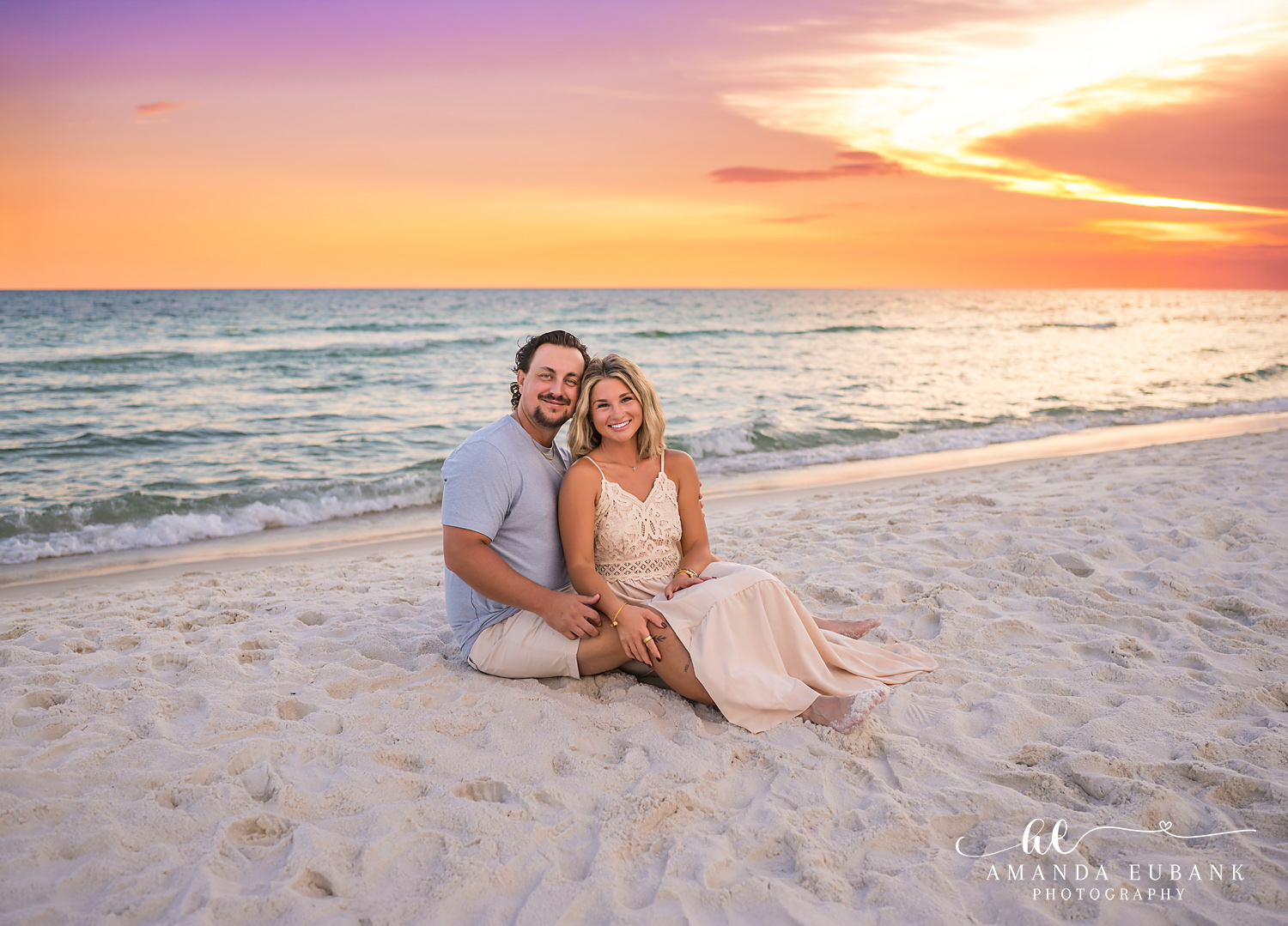 Rosemary Beach Family Photos | Couple sitting in the sand A couple sitting in the sand on the beach in Rosemary Beach, Florida at sunset, photographed by Rosemary Beach family photographer Amanda Eubank