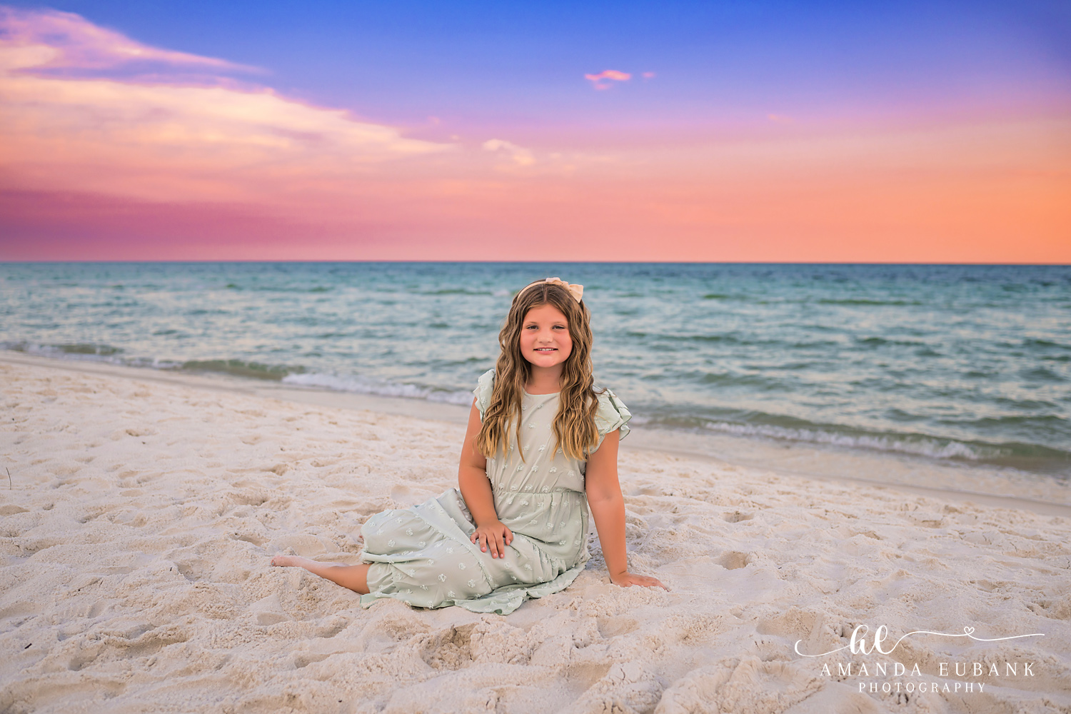 Rosemary Beach Family Photos | Girl sitting in the sand A girl sitting in the sand on the beach in Rosemary Beach, Florida at sunset, photographed by Rosemary Beach family photographer Amanda Eubank