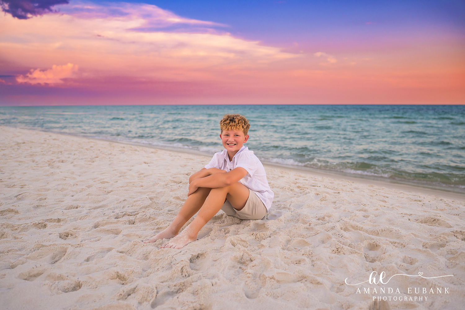 Rosemary Beach Family Photos | Boy sitting in the sand A boy sitting in the sand on the beach in Rosemary Beach, Florida at sunset, photographed by Rosemary Beach family photographer Amanda Eubank
