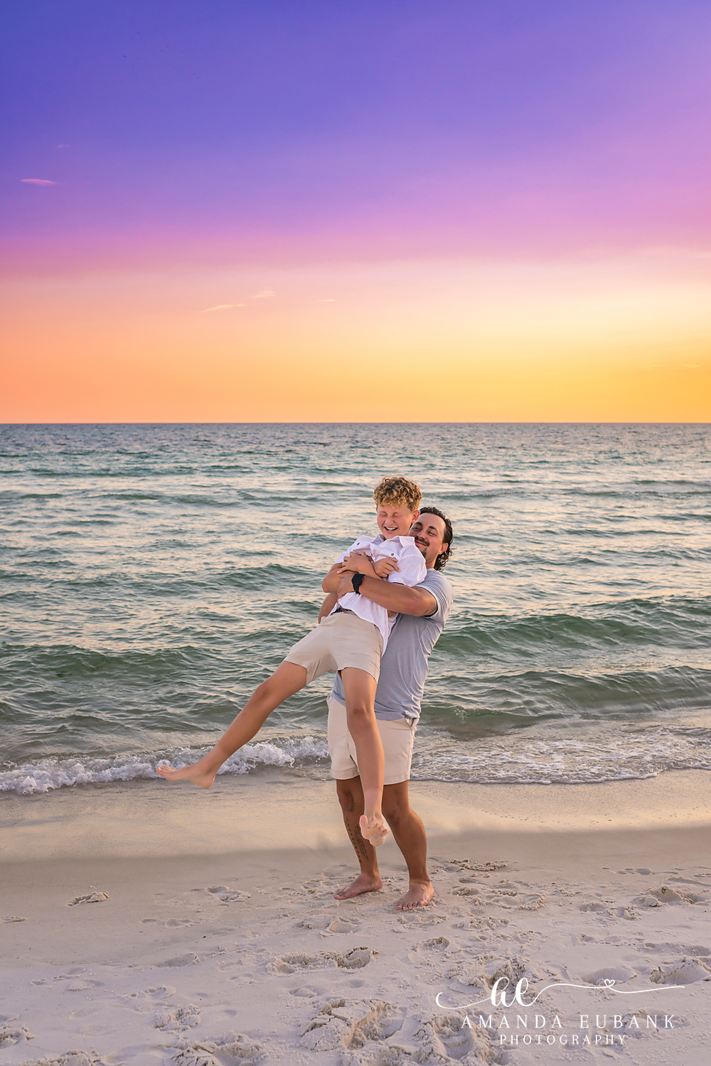 Rosemary Beach Family Photos | Dad swinging his child along the shoreline Dad swinging his child along the shoreline on the beach in Rosemary Beach, Florida at sunset, photographed by Rosemary Beach family photographer Amanda Eubank