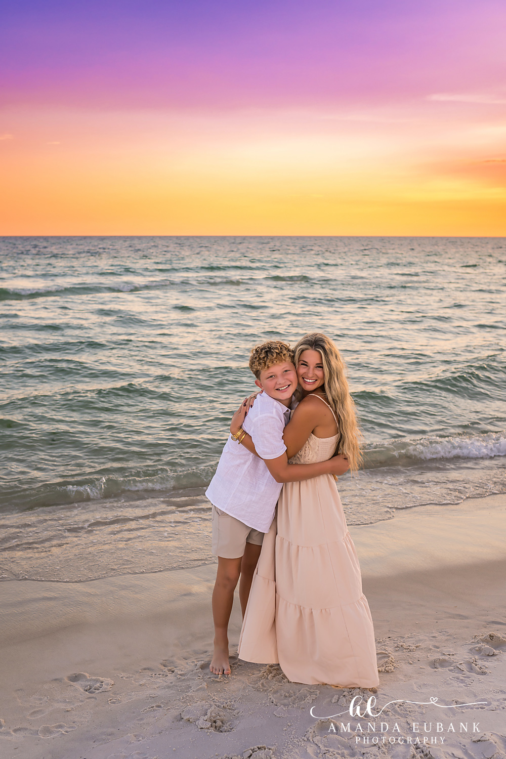 Rosemary Beach Family Photos | Mom and son hugging Mom and son hugging on the beach in Rosemary Beach, Florida at sunset, photographed by Rosemary Beach family photographer Amanda Eubank