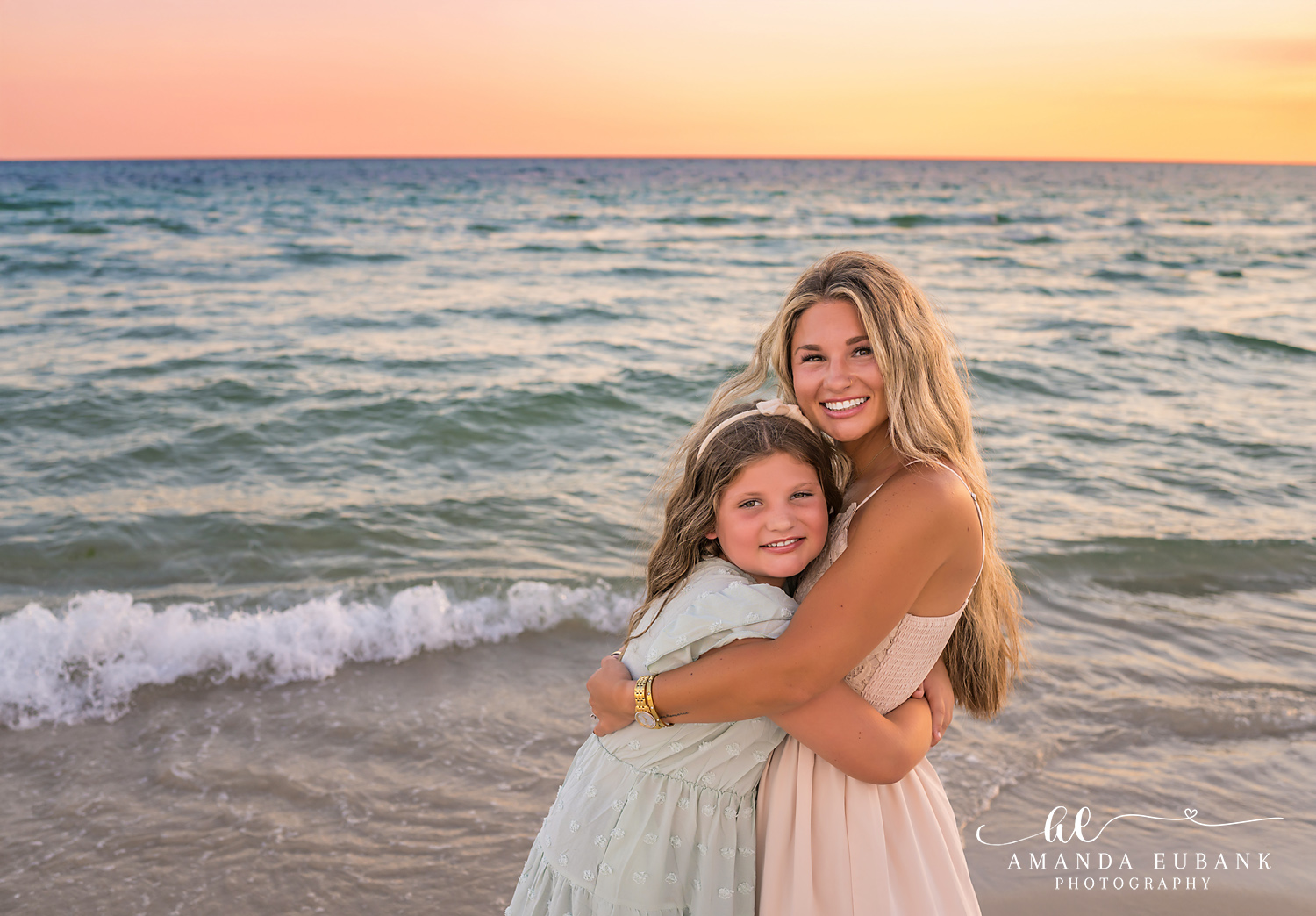 Rosemary Beach Family Photos | Mom and daughter hugging Mom and daughter hugging on the beach in Rosemary Beach, Florida at sunset, photographed by Rosemary Beach family photographer Amanda Eubank