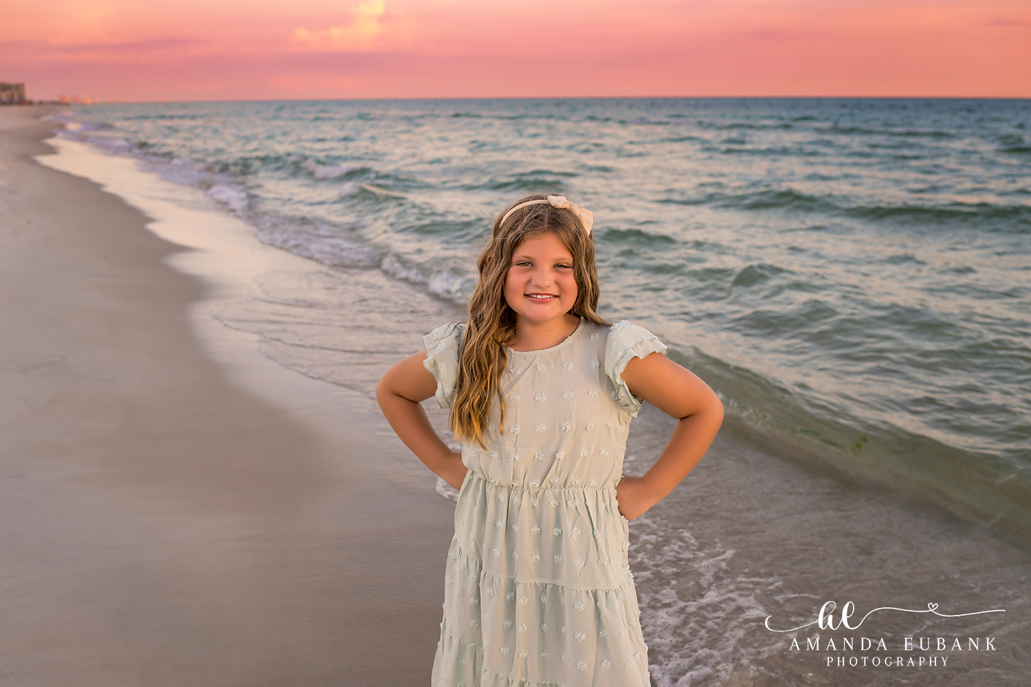 Rosemary Beach Family Photos | Girl in a green dress smiling A girl in a green dress smiling on the beach in Rosemary Beach, Florida at sunset, photographed by Rosemary Beach family photographer Amanda Eubank