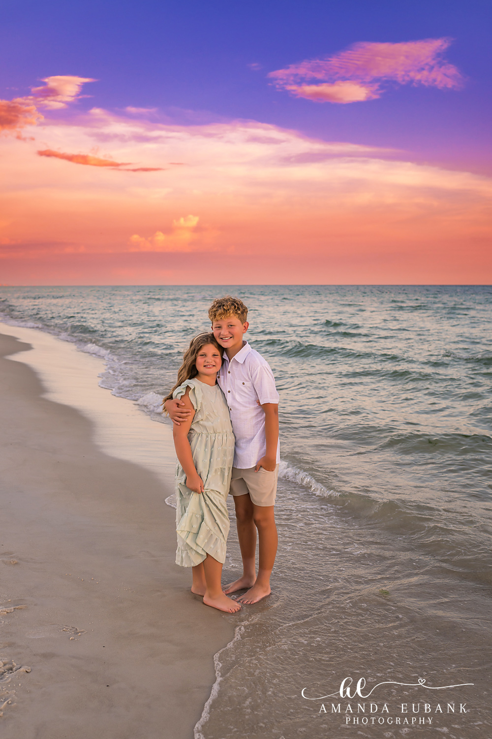 Rosemary Beach Family Photos | Brother and sister standing together 2 A brother and sister standing together on the beach in Rosemary Beach, Florida at sunset, photographed by Rosemary Beach family photographer Amanda Eubank
