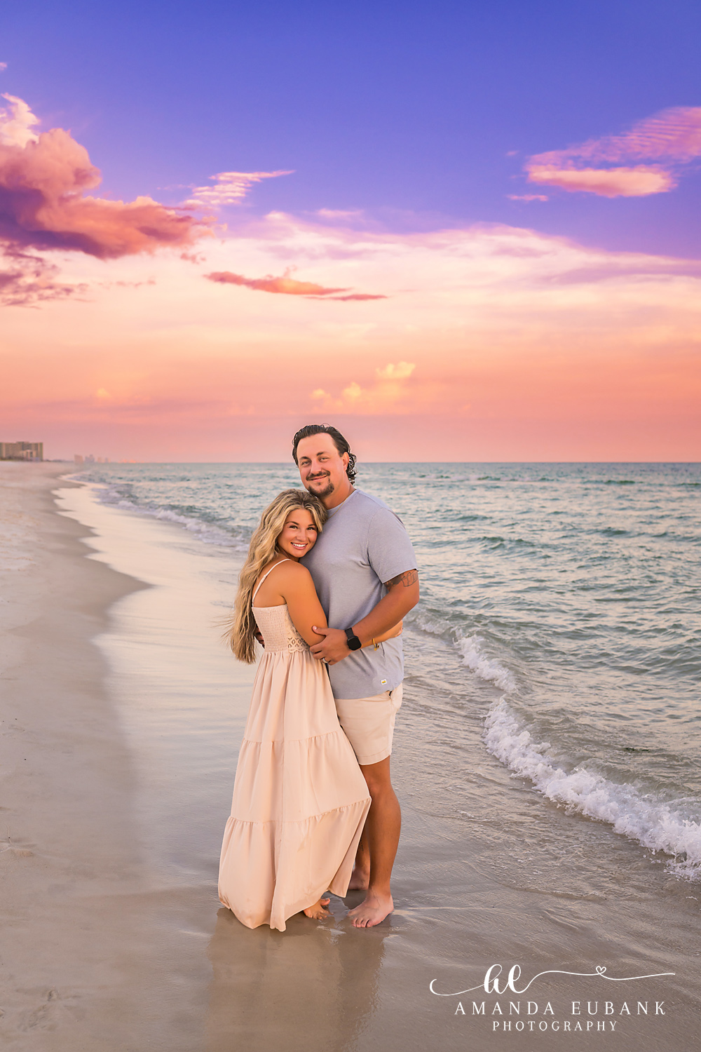 Rosemary Beach Family Photos | Couple posing on the shoreline A couple posing on the shoreline on the beach in Rosemary Beach, Florida at sunset, photographed by Rosemary Beach family photographer Amanda Eubank