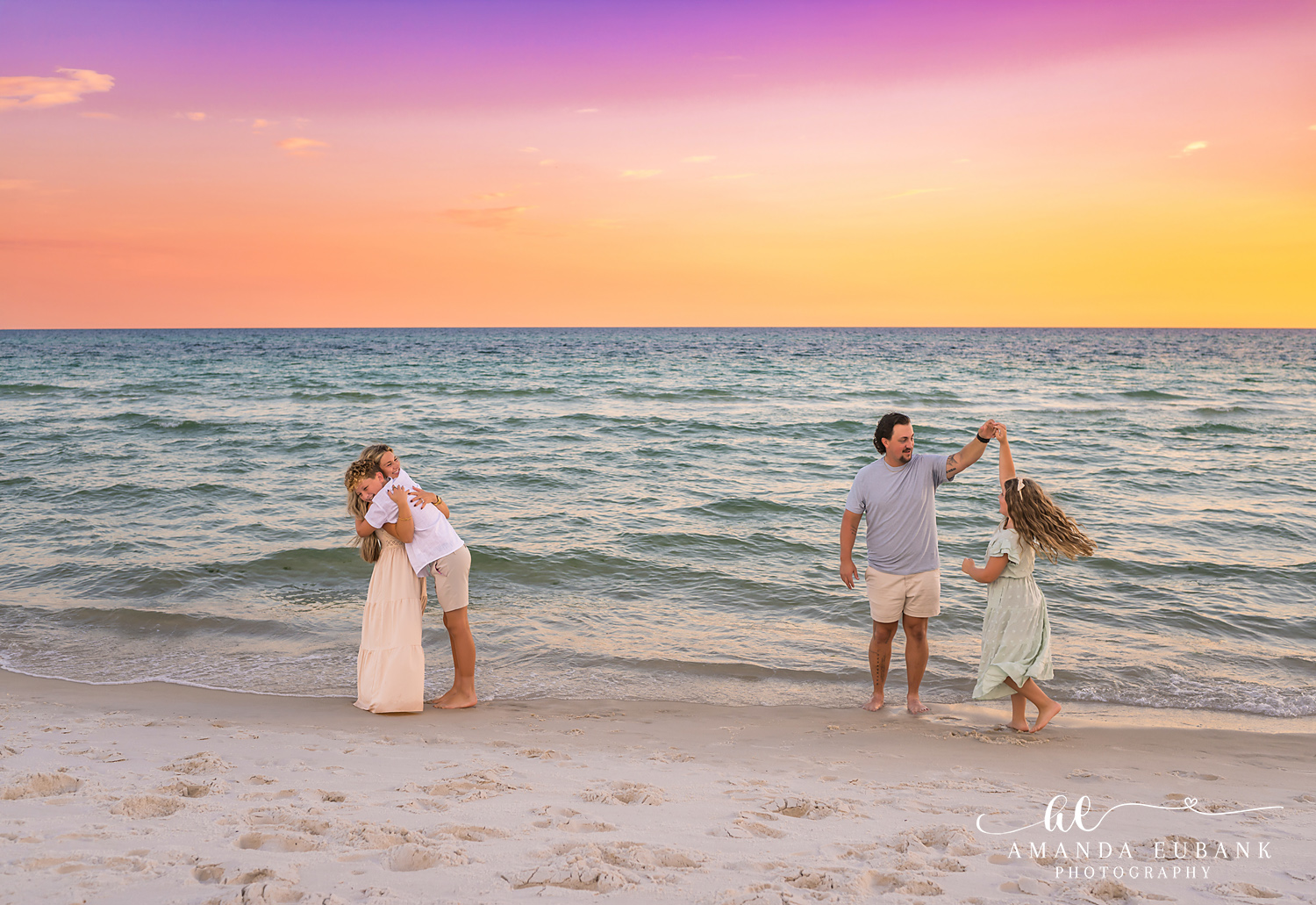 Rosemary Beach Family Photos | Family laughing and playing together A family laughing and playing together on the beach in Rosemary Beach, Florida at sunset, photographed by Rosemary Beach family photographer Amanda Eubank