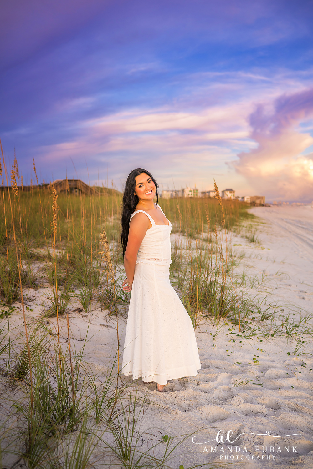 Rosemary Beach Senior Photos | Standing in the dunes Rosemary Beach senior photographer: senior girl in a white dress standing in the sea oats on a dune looking up toward the sky