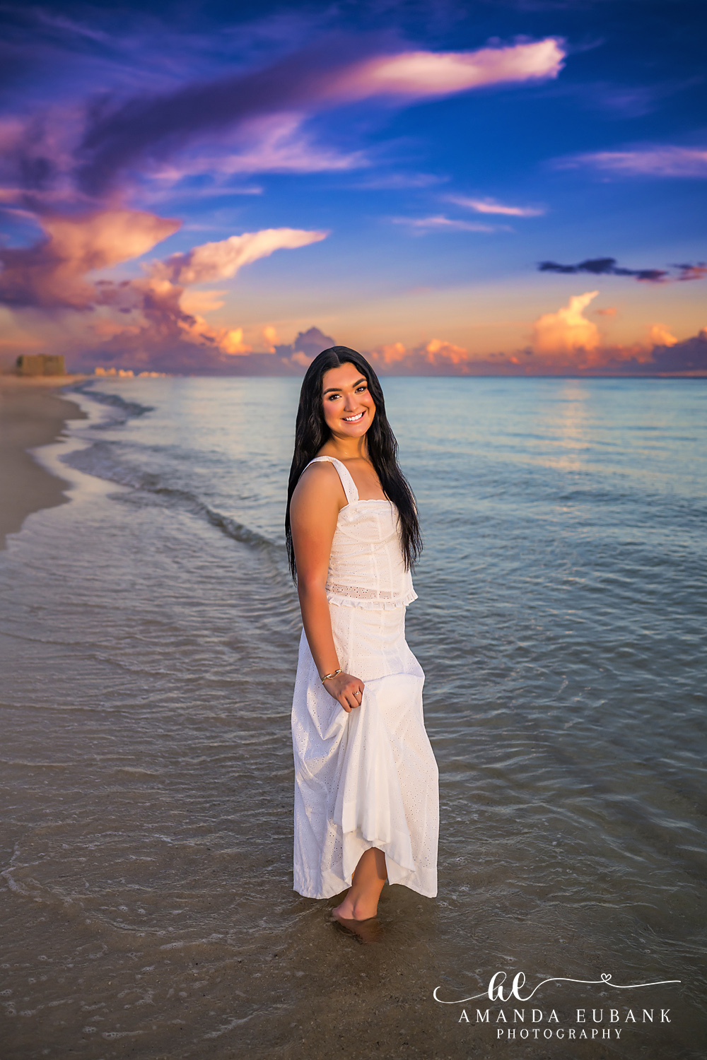 Rosemary Beach Senior Photos | Ankle deep in the Gulf Rosemary Beach senior photographer: senior girl in a white dress standing ankle deep in the Gulf with a purple and pink sky